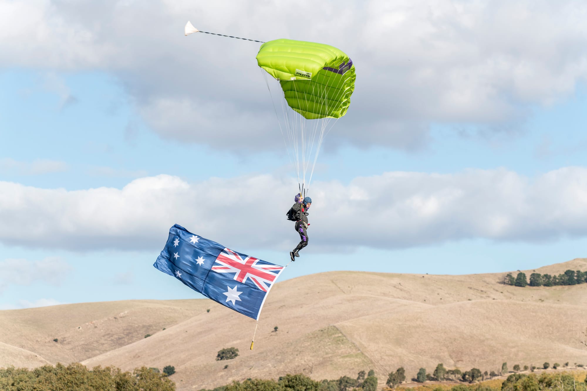 Parachutist landing with an Australian flag at the 2023 event.
Photo Allan Griffin