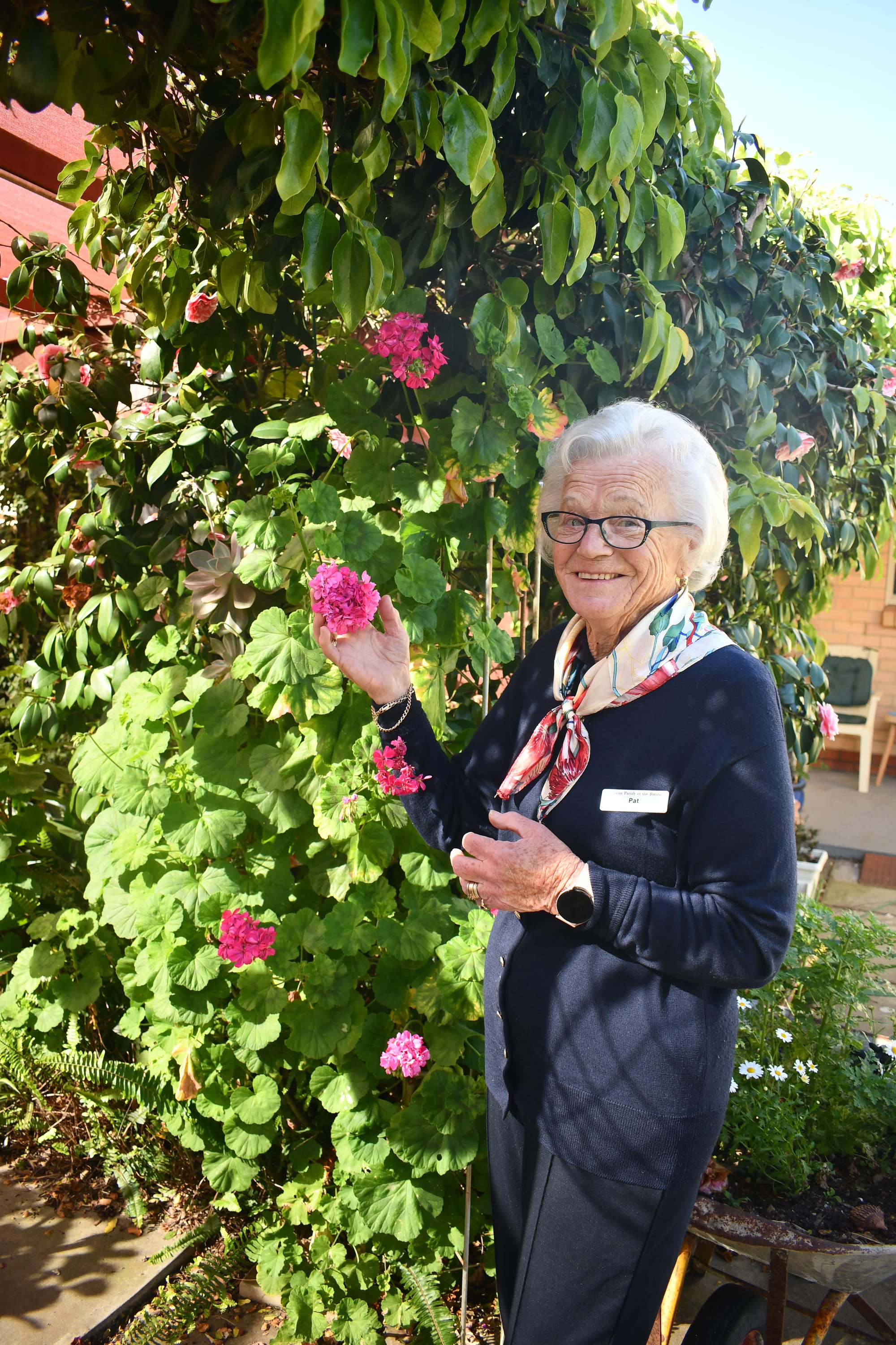 Pat stops to smell the flowers