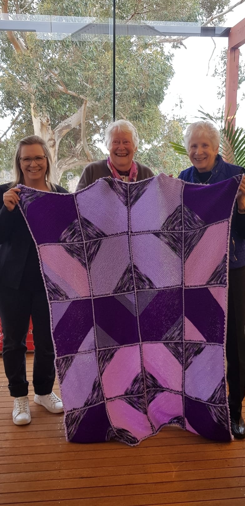 Knitter Natters rug up for cancer patients