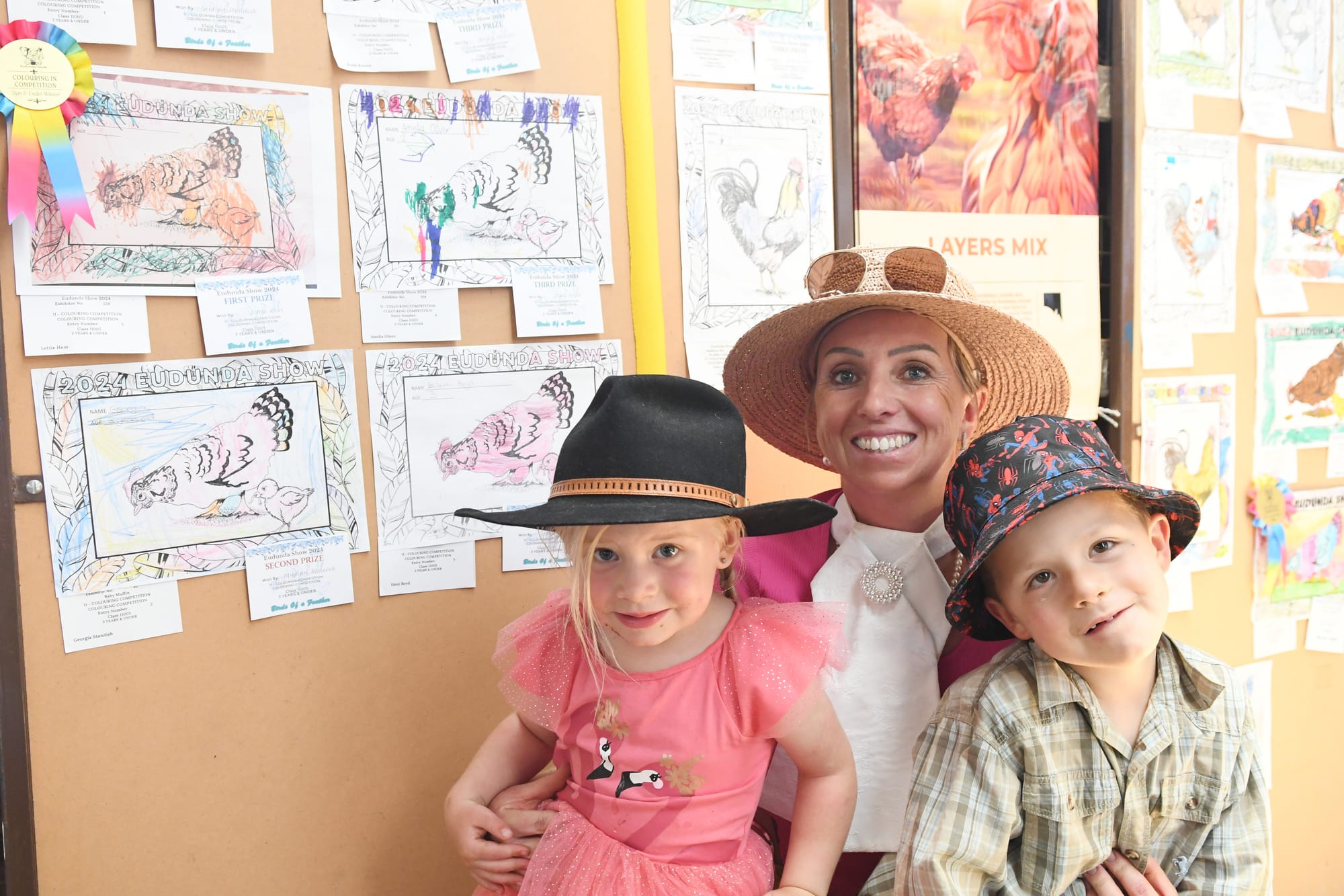 Lottie, Vicki and Curtis Hein from Nildottie enjoy the colour-ins at the Poultry shed.