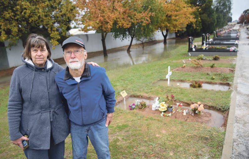 Flooded graves cause distress post image