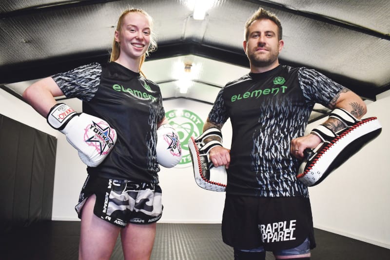 Focused young fighter makes martial arts history post image